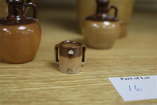 A pair of Doulton Lambeth stoneware jardinieres, three jugs and a tyg